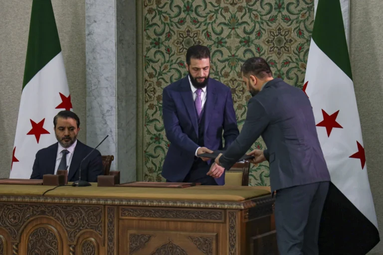 Syrian Leader Signs Temporary Constitution Establishing Islamist Rule for 5 Years