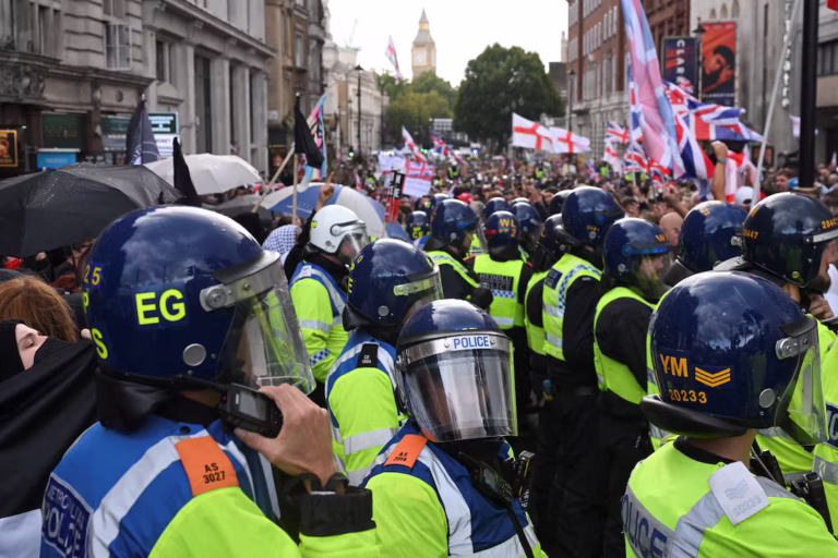 Police clash with protesters as 110,000 join anti-migrant march in London